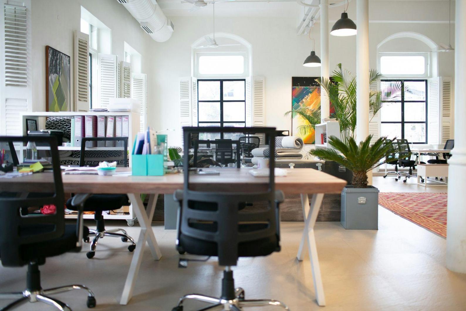 Workshop participants collaborating on budget planning exercises during evening session