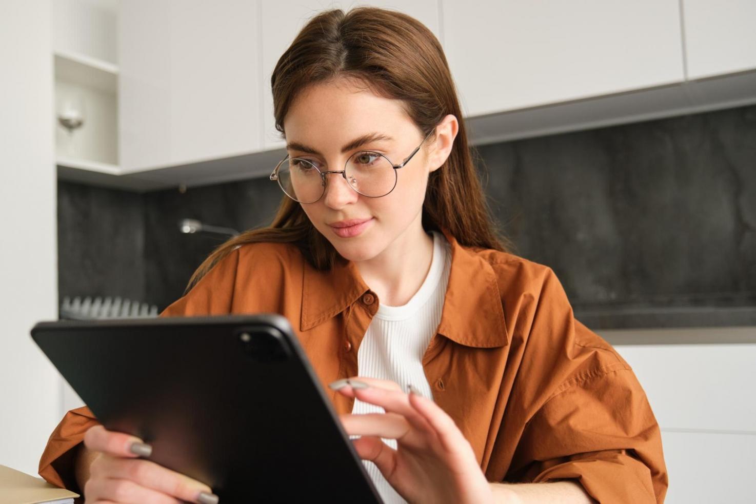 Person reviewing financial documents with calculator